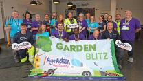 Volunteers and staff from Age Action posing with Garden Blitz Banner
